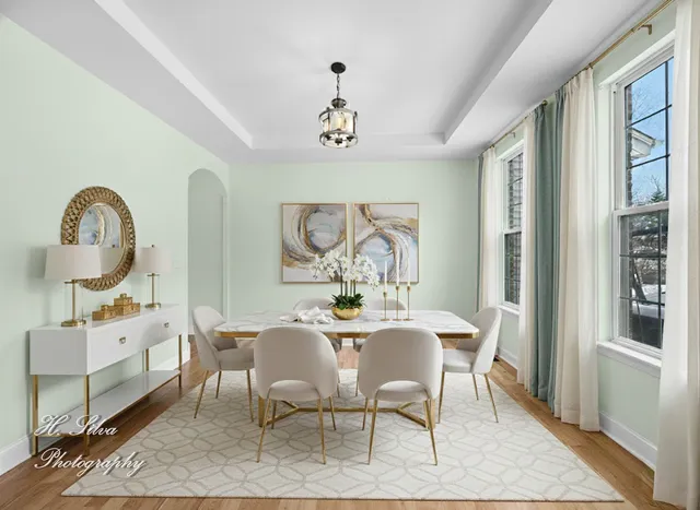 a view of a dining room with furniture window and wooden floor