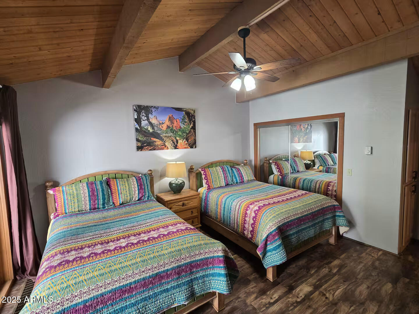 8351 North State Rte 89A, Unit 33 Sedona, AZ 86336 - Photo 16 of 41 a bedroom with two beds and a chandelier