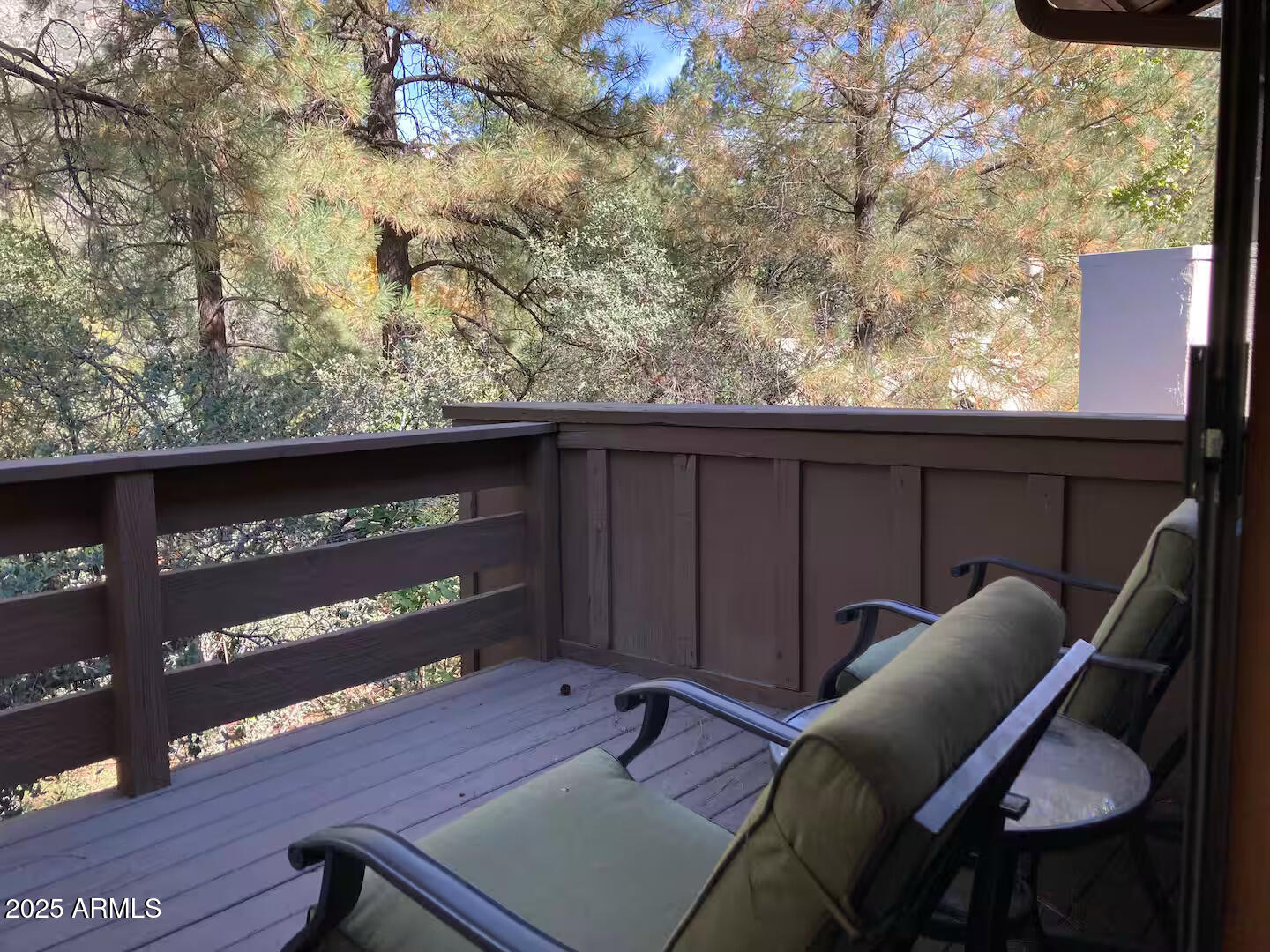 8351 North State Rte 89A, Unit 33 Sedona, AZ 86336 - Photo 23 of 41 a view of a balcony with chair and wooden floor