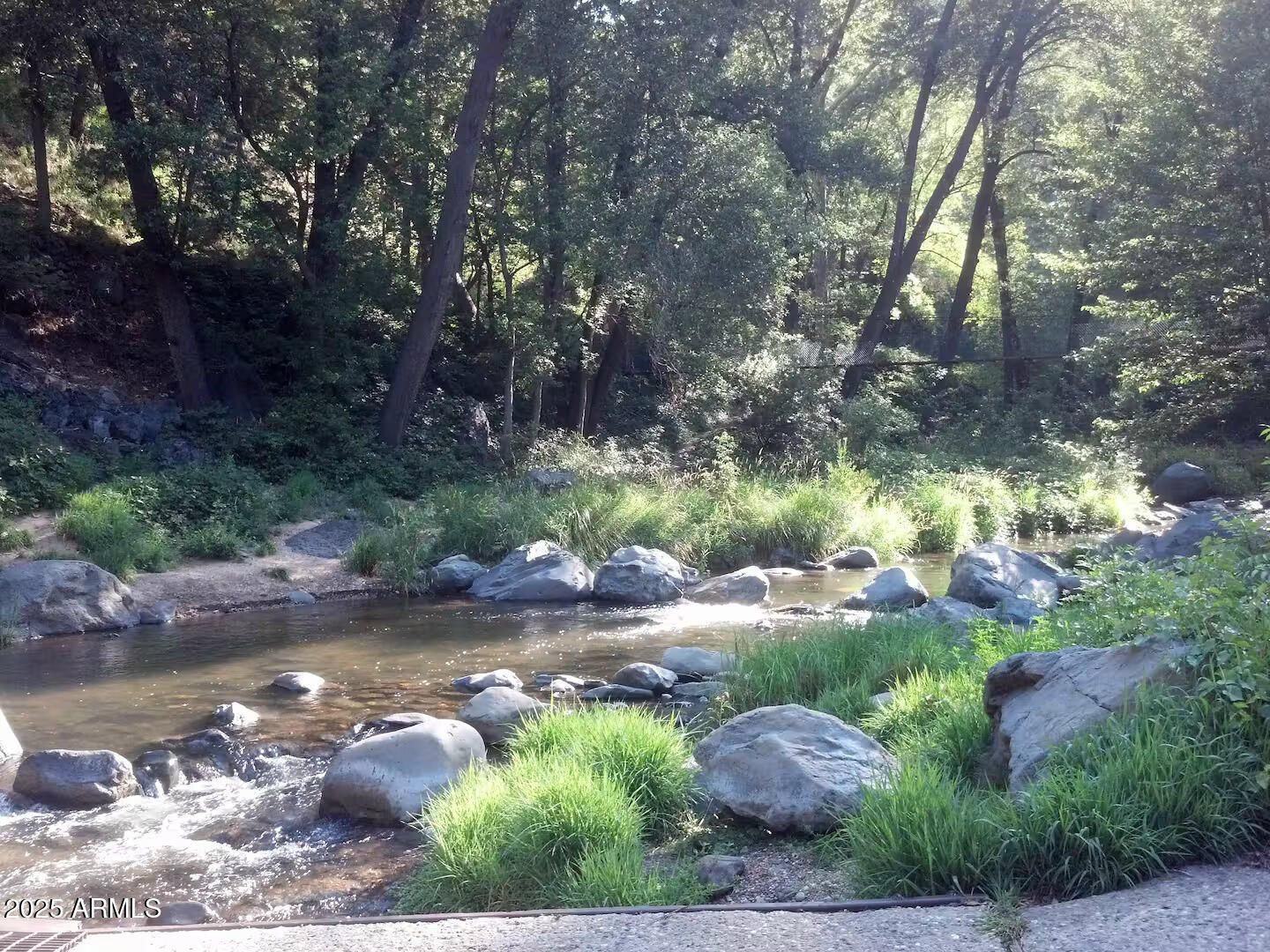 8351 North State Rte 89A, Unit 33 Sedona, AZ 86336 - Photo 36 of 41 a view of a lake with huge green field