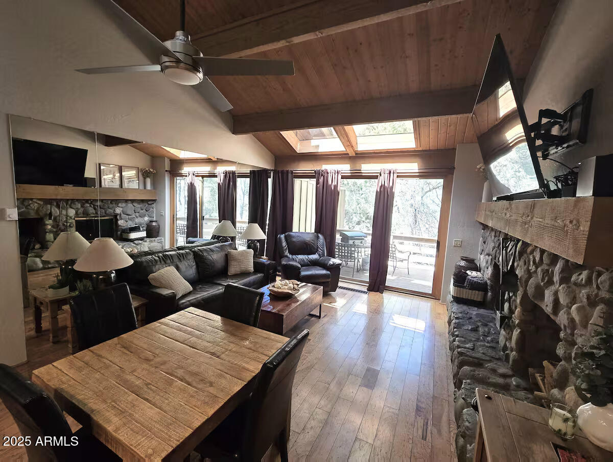 8351 North State Rte 89A, Unit 33 Sedona, AZ 86336 - Photo 5 of 41 a view of a dining room with furniture window and wooden floor
