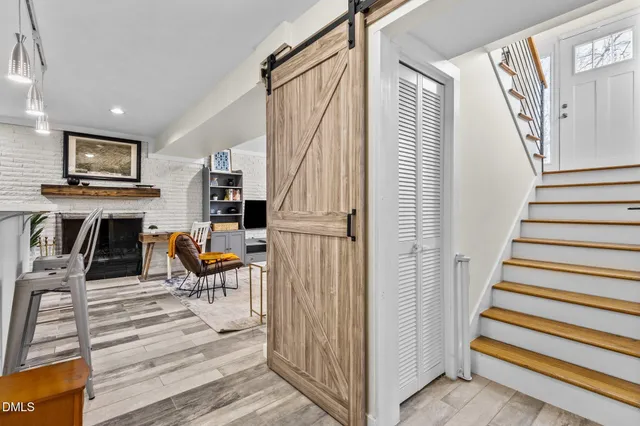 an aerial view of a house with garden space and a street view