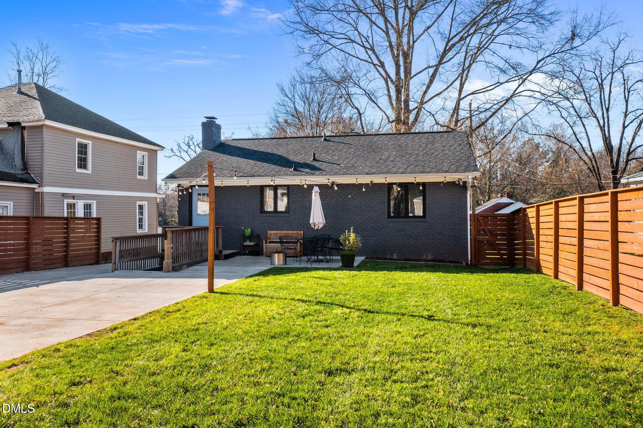 1023 Holmes Street Raleigh, NC 27601 - Photo 35 of 41 a house view with a sitting space and garden