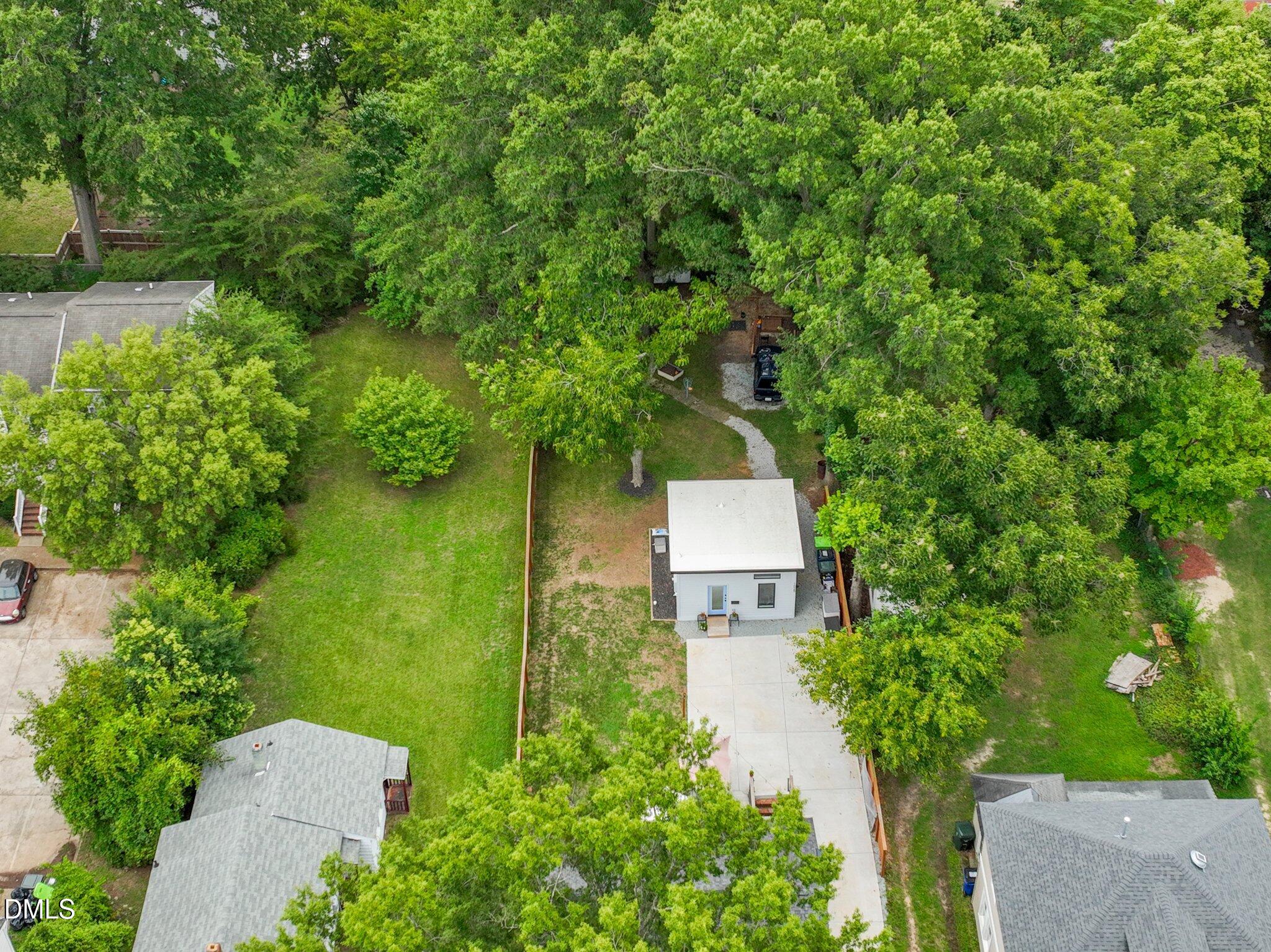1023 Holmes Street Raleigh, NC 27601 - Photo 38 of 41 an aerial view of a house with garden space and a street view