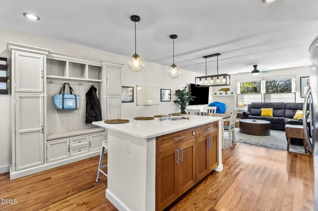 a kitchen with a sink stove and microwave
