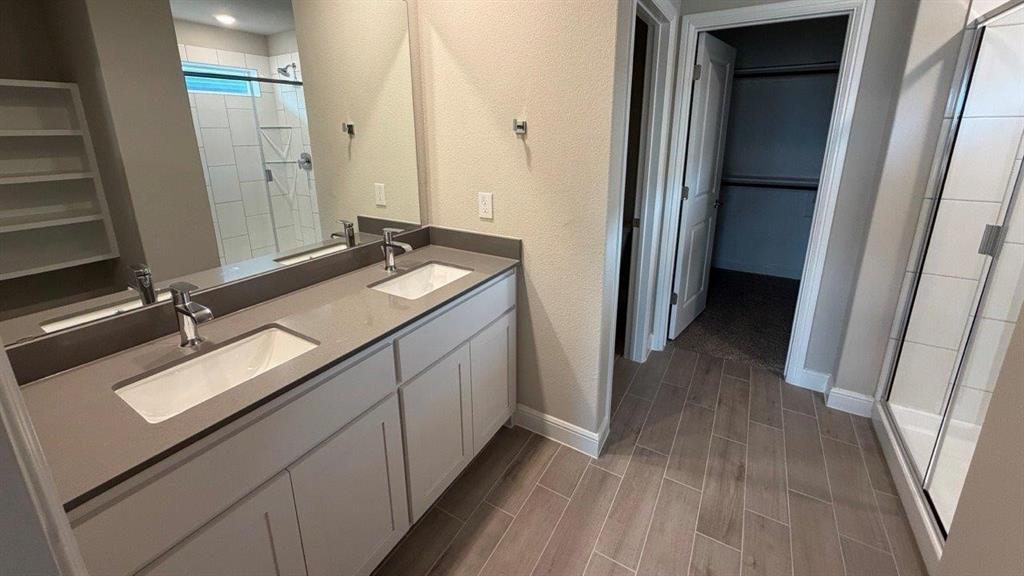 1704 River Bend Road Burleson, TX 76028 - Photo 9 of 19 a bathroom with a sink double vanity and a mirror