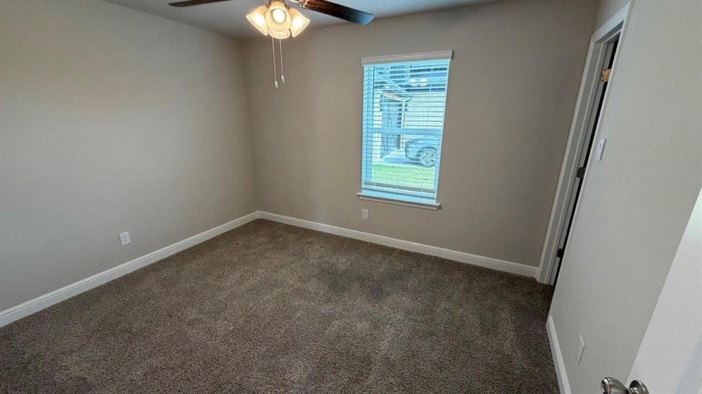 1704 River Bend Road Burleson, TX 76028 - Photo 12 of 19 an empty room with a window