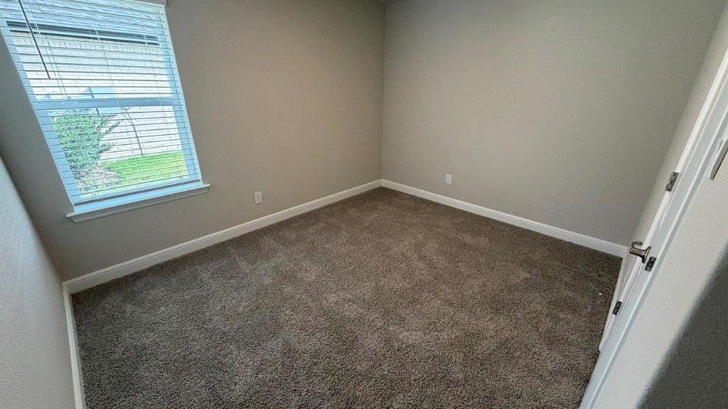 1704 River Bend Road Burleson, TX 76028 - Photo 13 of 19 an empty room with a window