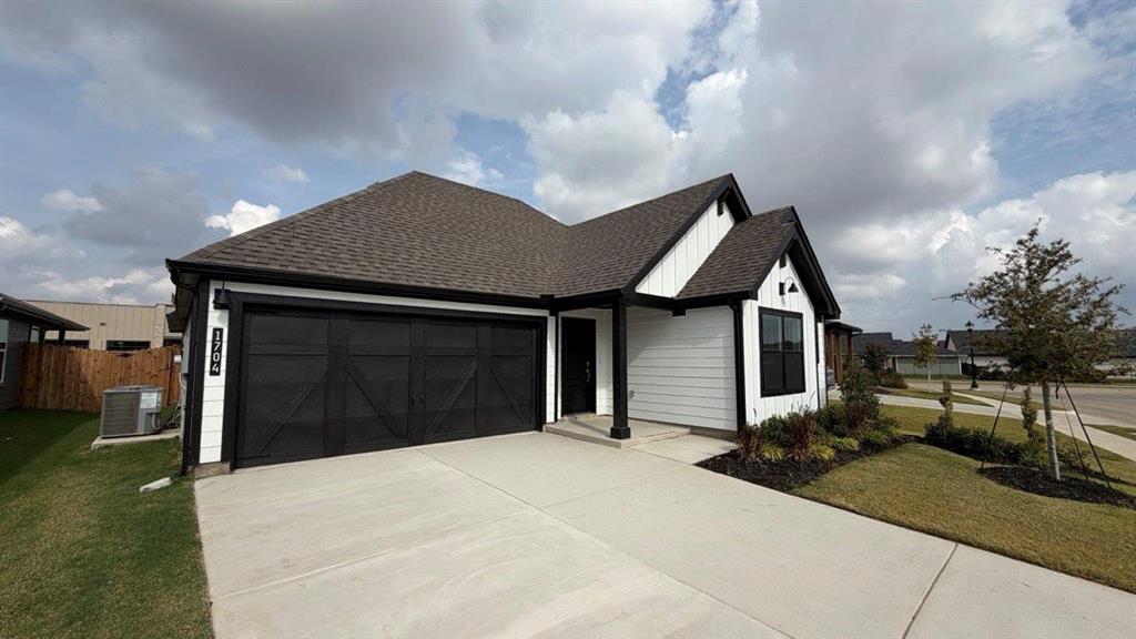 1704 River Bend Road Burleson, TX 76028 - Photo 2 of 19 a front view of a house with a yard and garage