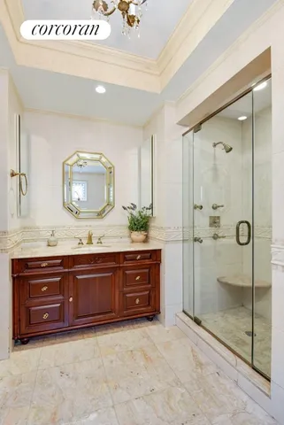 a bathroom with a granite countertop sink mirror and a bathtub