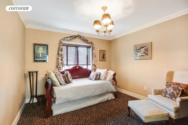 a living room with furniture and a mirror