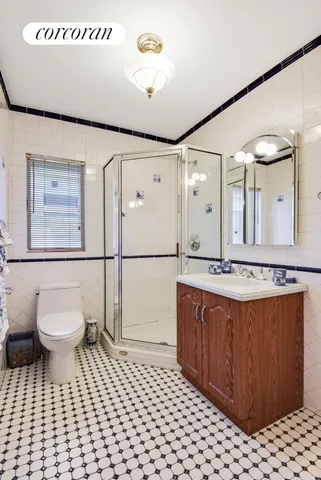 a bathroom with a sink a toilet and mirror