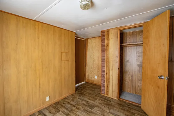 a view of a bathroom with shower and wooden floor