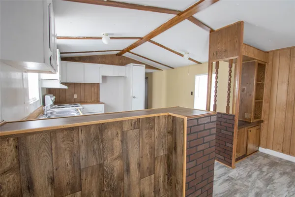 a view of kitchen with wooden floor