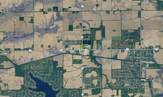 a aerial view of a residential apartment building with a yard