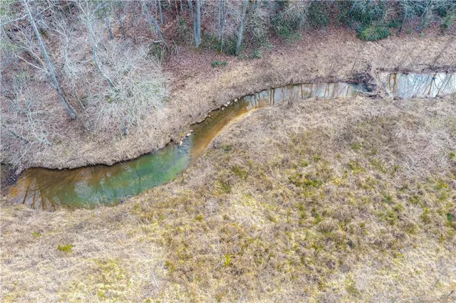 a view of a wooden floor with a lake view