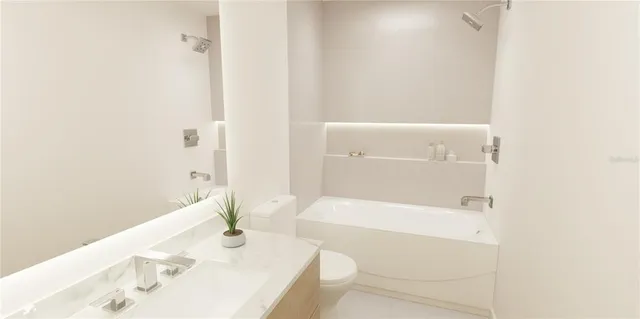 a bathroom with a bathtub and a sink