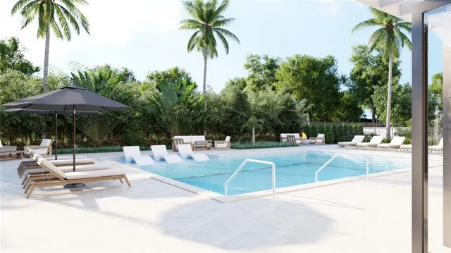 a view of swimming pool with outdoor seating