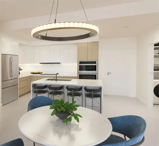 a kitchen with a table and chairs