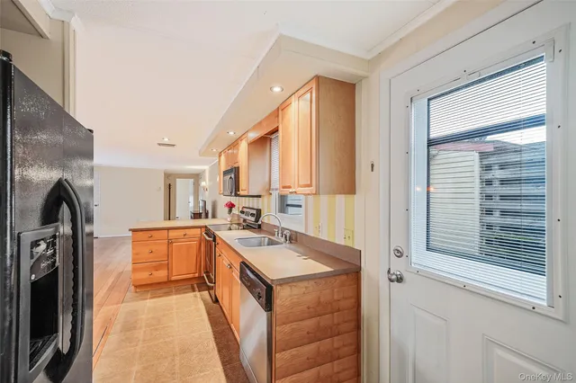 a kitchen with stainless steel appliances a stove sink and cabinets
