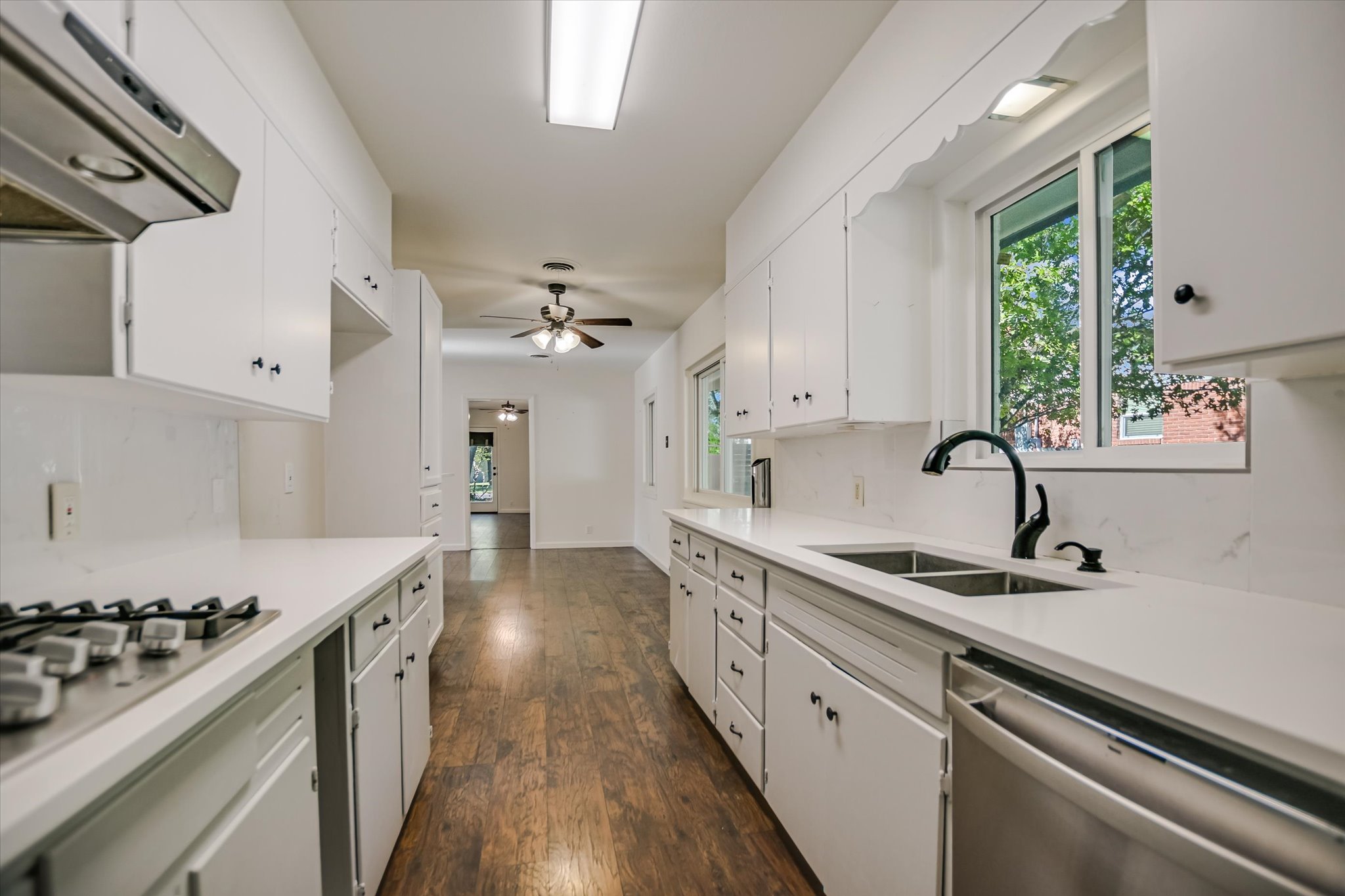 1601 East 19th Street Georgetown, TX 78626 - Photo 16 of 31 a kitchen with a sink stove and cabinets