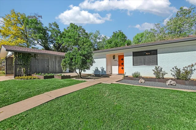 a house view with a garden space and street view