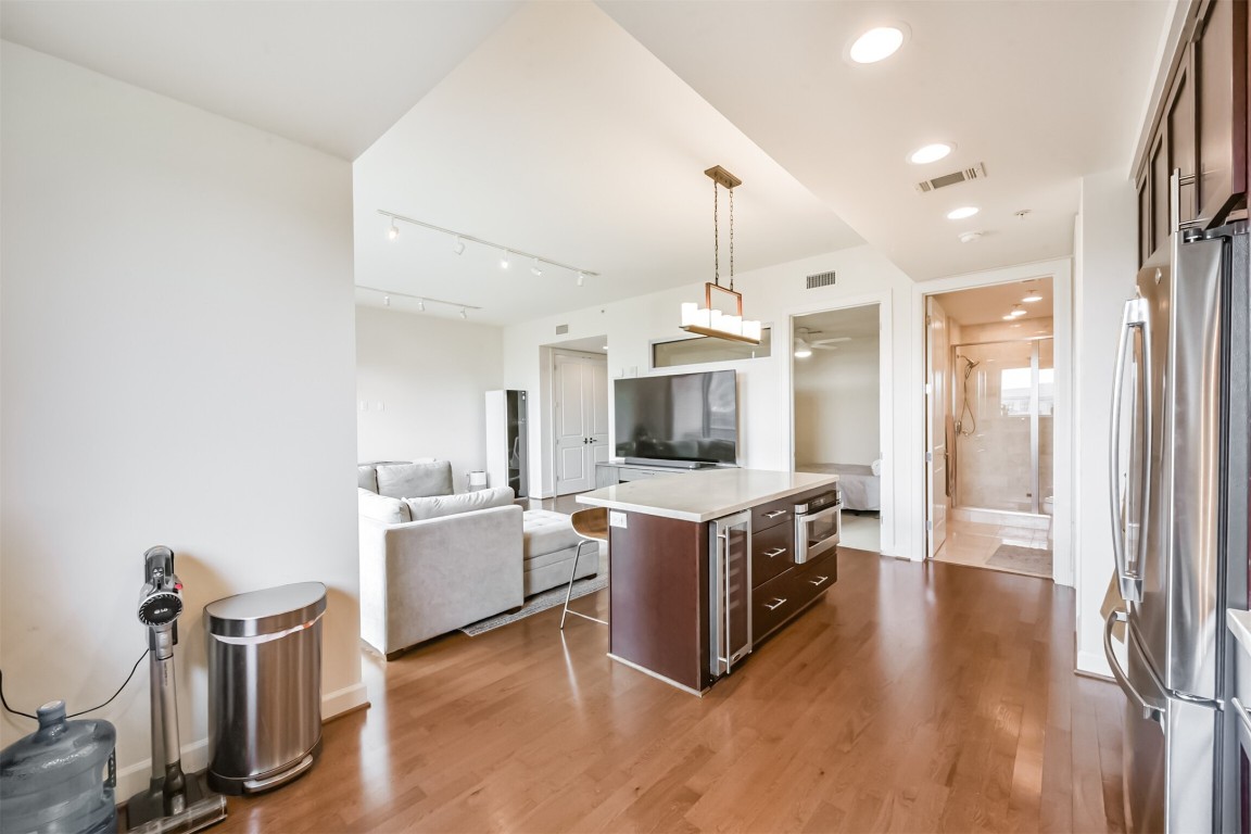 2207 Bancroft Lane, Unit 706 Houston, TX 77027 - Photo 13 of 43 a large kitchen with a table and chairs