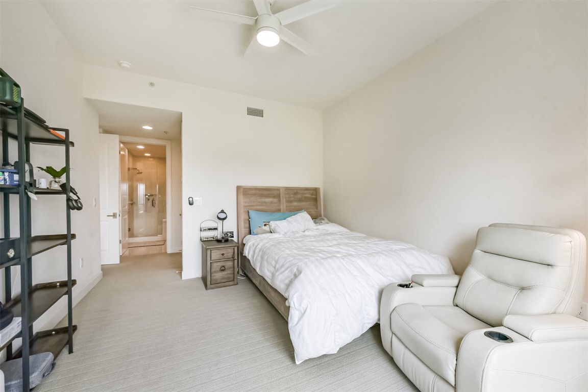 2207 Bancroft Lane, Unit 706 Houston, TX 77027 - Photo 15 of 43 a bedroom with a bed and a couch
