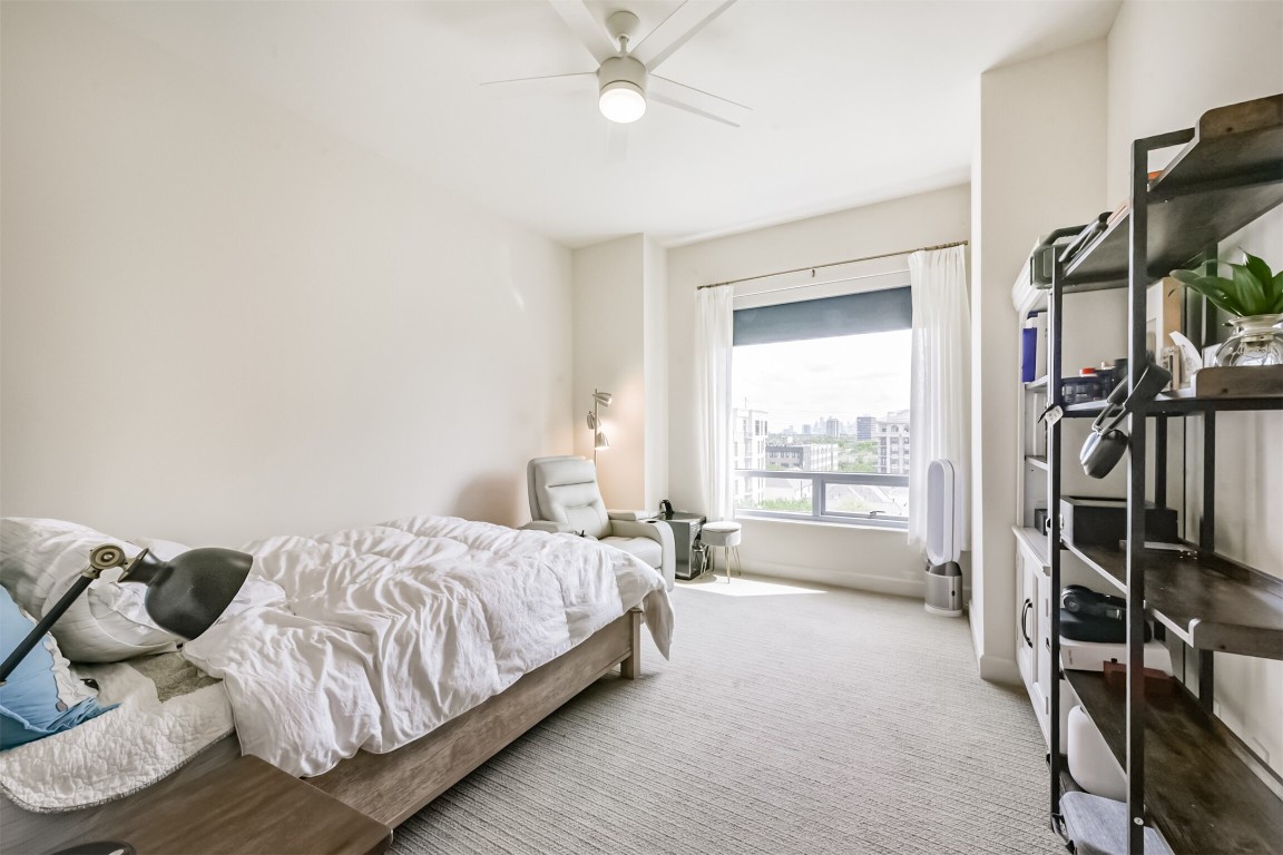 2207 Bancroft Lane, Unit 706 Houston, TX 77027 - Photo 16 of 43 a bedroom with a bed and a walk in closet