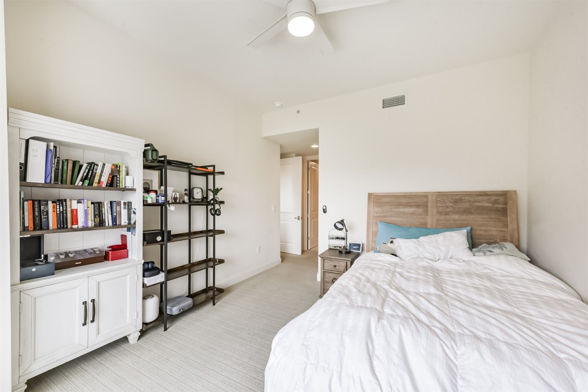 2207 Bancroft Lane, Unit 706 Houston, TX 77027 - Photo 17 of 43 a bedroom with a bed and white cabinets