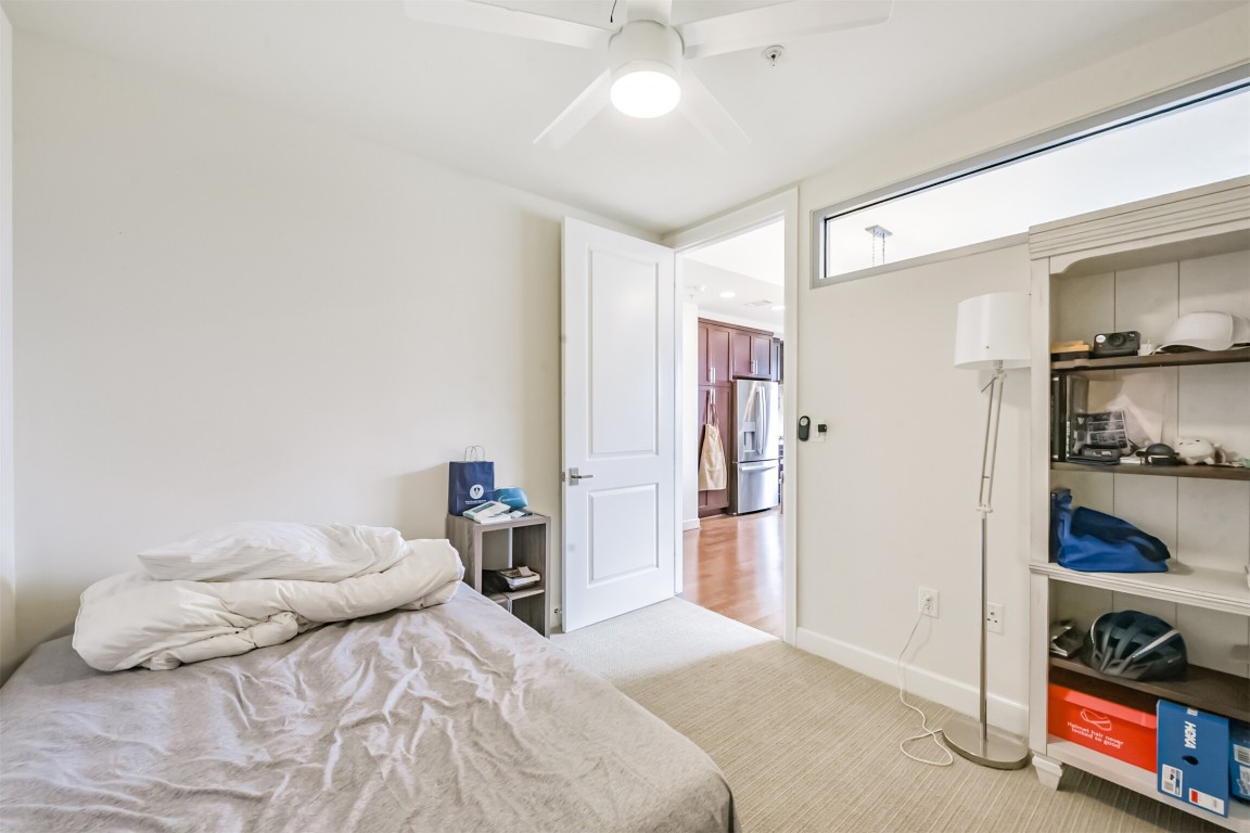 2207 Bancroft Lane, Unit 706 Houston, TX 77027 - Photo 24 of 43 a bedroom with a bed and a window with closet