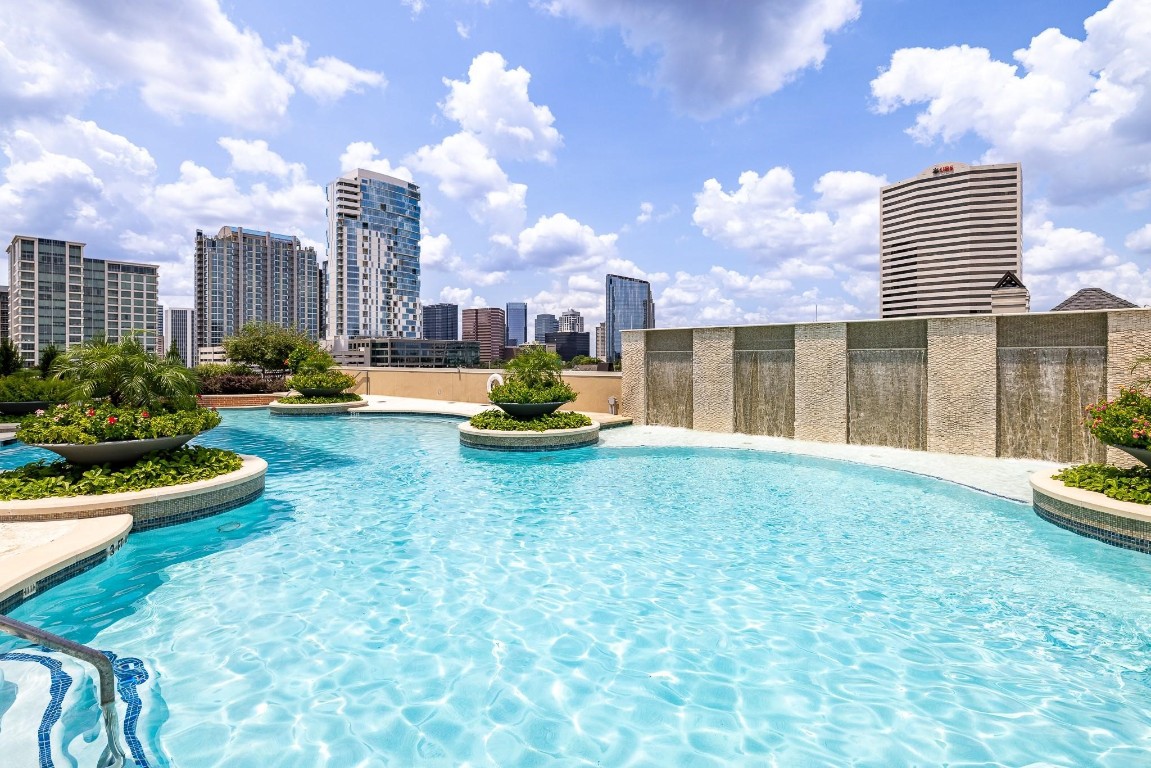 2207 Bancroft Lane, Unit 706 Houston, TX 77027 - Photo 37 of 43 a swimming pool with outdoor seating and yard