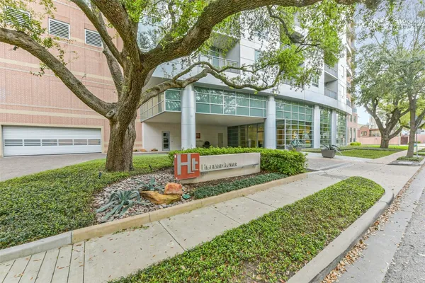 a view of a building with lot of trees