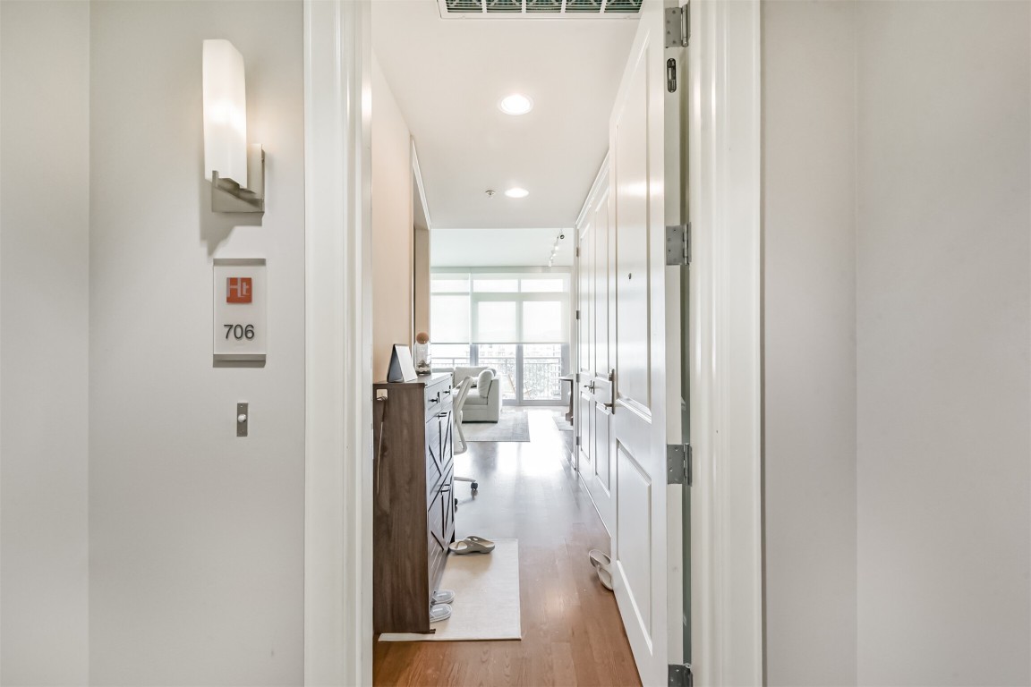 2207 Bancroft Lane, Unit 706 Houston, TX 77027 - Photo 5 of 43 a view of a hallway with a livingroom and dining room with furniture