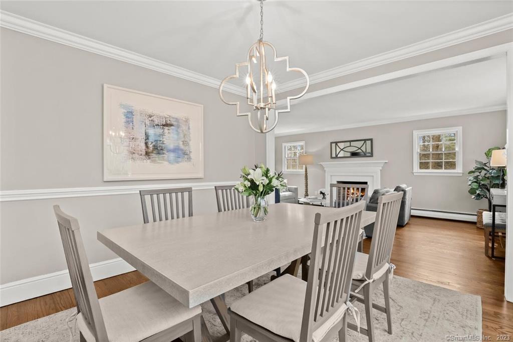 183 Frogtown Road New Canaan, CT 06840 - Photo 7 of 37 a view of a dining room with furniture window and wooden floor