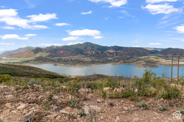 10677 North Reflection Ridge, Unit 1 Hideout, UT 84036 - Photo 14 of 41 View of mountain background with a nearby body of water
