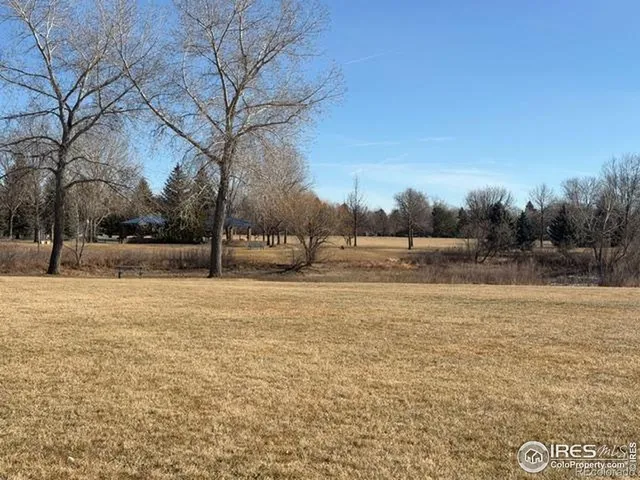 a view of ocean with a big yard
