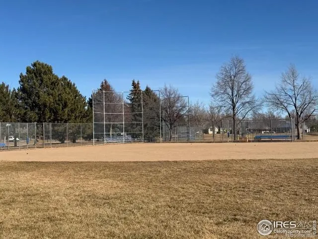 a view of a patio with couches and table and chairs and potted plants