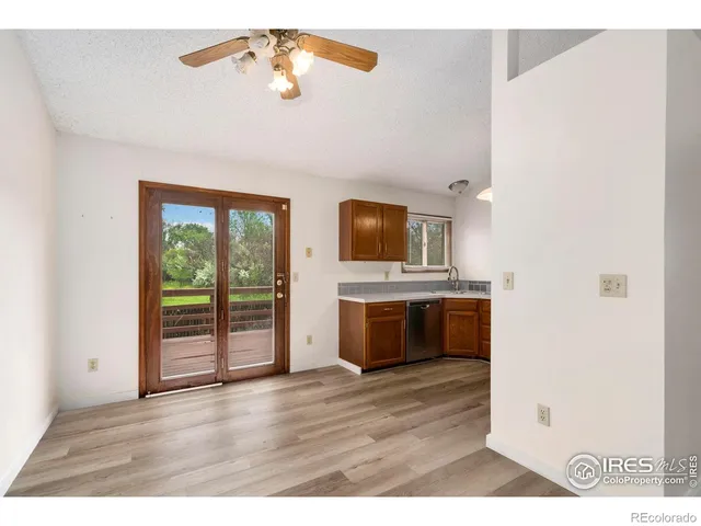 a view interior of kitchen and hall with wooden floor