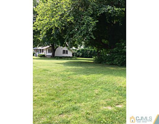 462 Ridge Road Dayton, NJ 08810 - Photo 22 of 25 a front view of a house with a yard