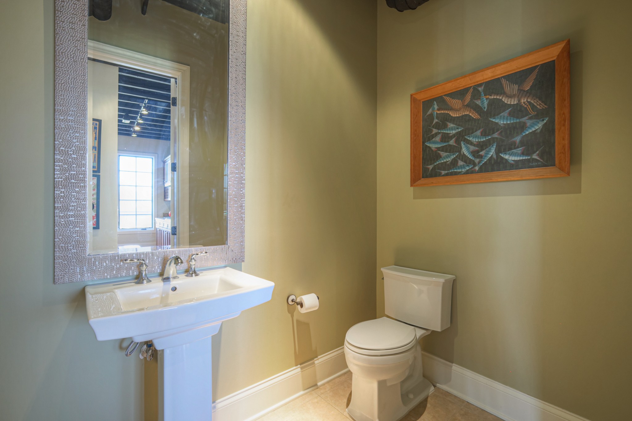 320 Liberty Pike, Unit 214 Franklin, TN 37064 - Photo 18 of 53 a bathroom with a sink and a toilet