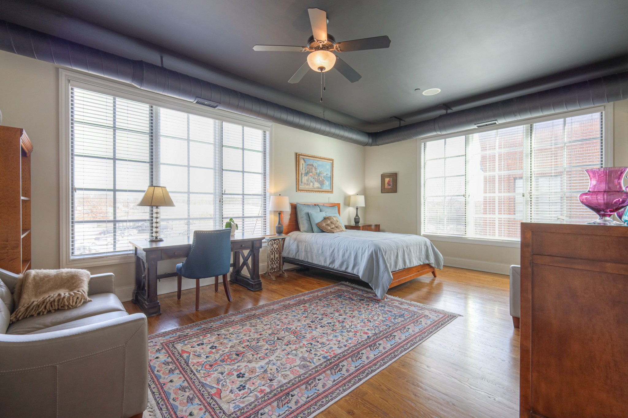 320 Liberty Pike, Unit 214 Franklin, TN 37064 - Photo 20 of 53 a bedroom with a bed a couch and a window