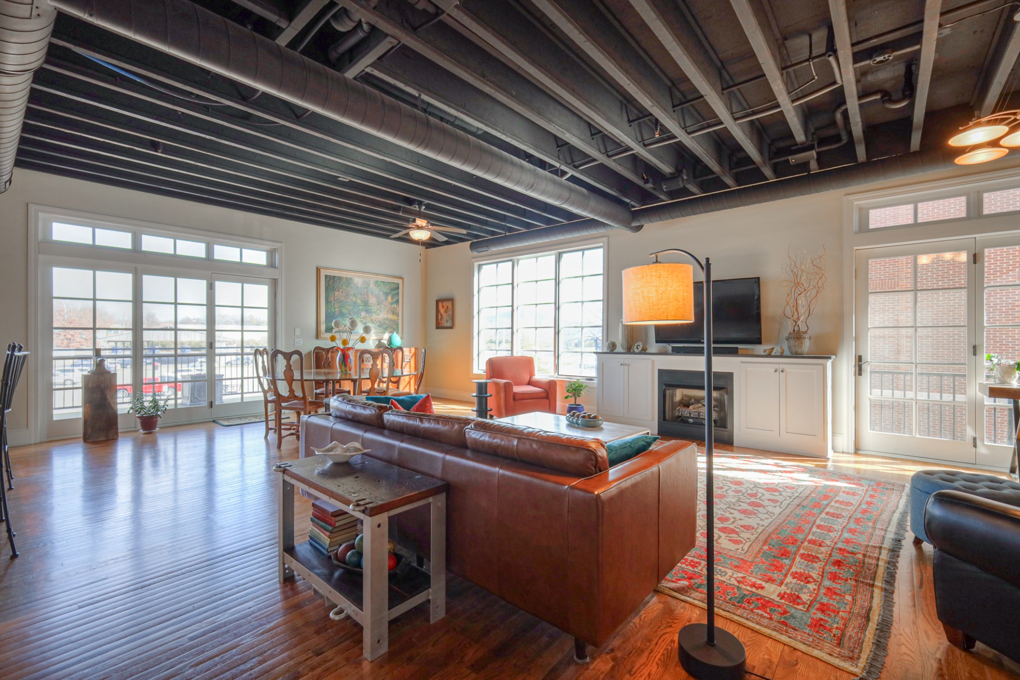 320 Liberty Pike, Unit 214 Franklin, TN 37064 - Photo 2 of 53 a view of a dining room with furniture wooden floor and chandelier