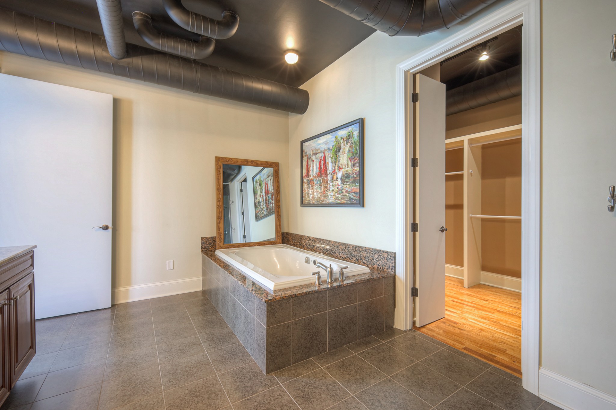 320 Liberty Pike, Unit 214 Franklin, TN 37064 - Photo 24 of 53 a spacious bathroom with a tub and shower
