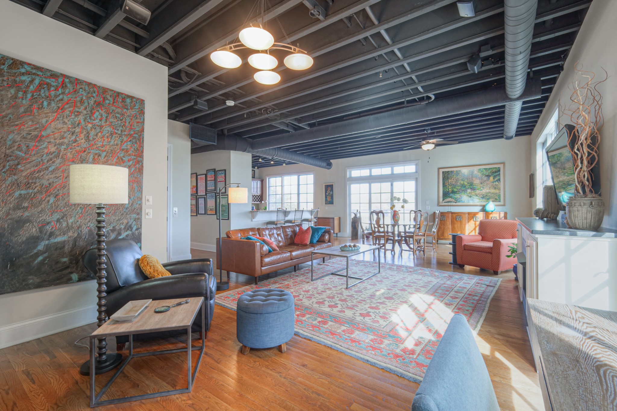320 Liberty Pike, Unit 214 Franklin, TN 37064 - Photo 4 of 53 a living room with furniture a fireplace and a chandelier