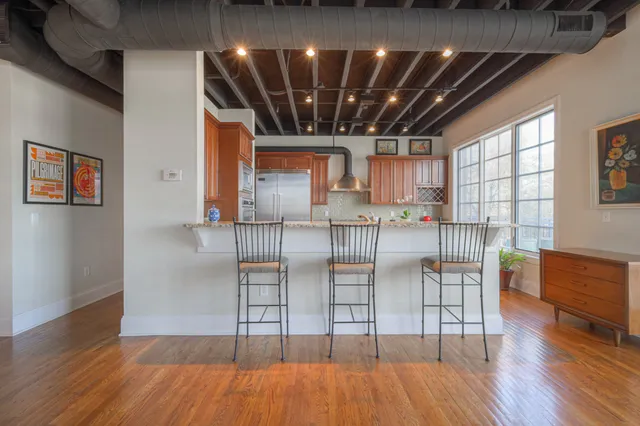 a view of kitchen with cabinets and wooden floor