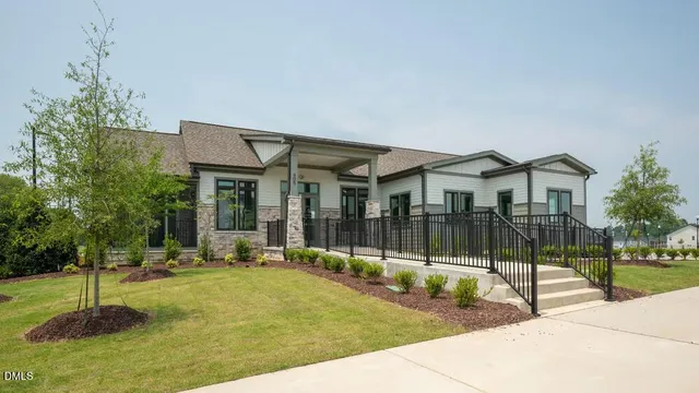 a house with swimming pool in front of it
