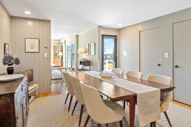 a view of a dining room with furniture and window