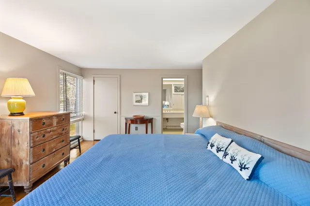 a bed room with a bed and window