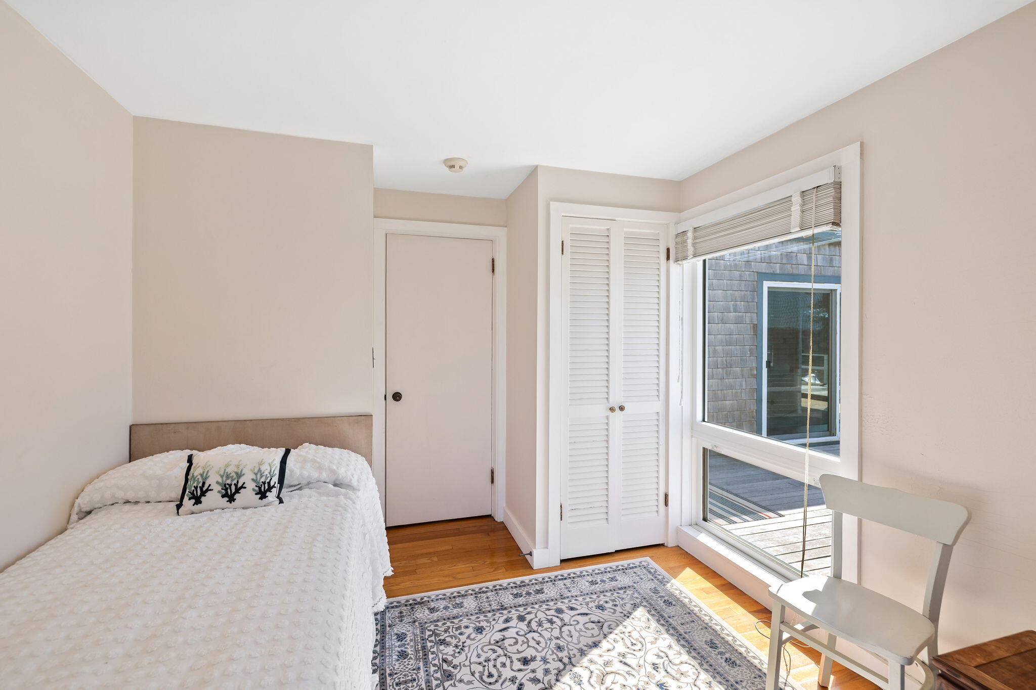 169 Penzance Road Woods Hole, MA 02543 - Photo 23 of 41 a bedroom with a bed and a window